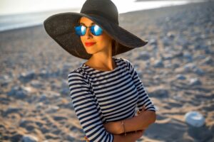 women in hat with sunglasses on